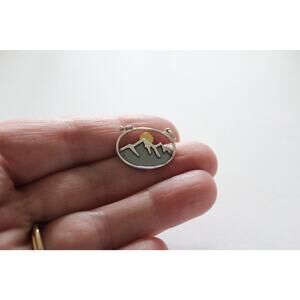 Sterling Silver Oval Mountain Pendant with Bronze Sun Charm